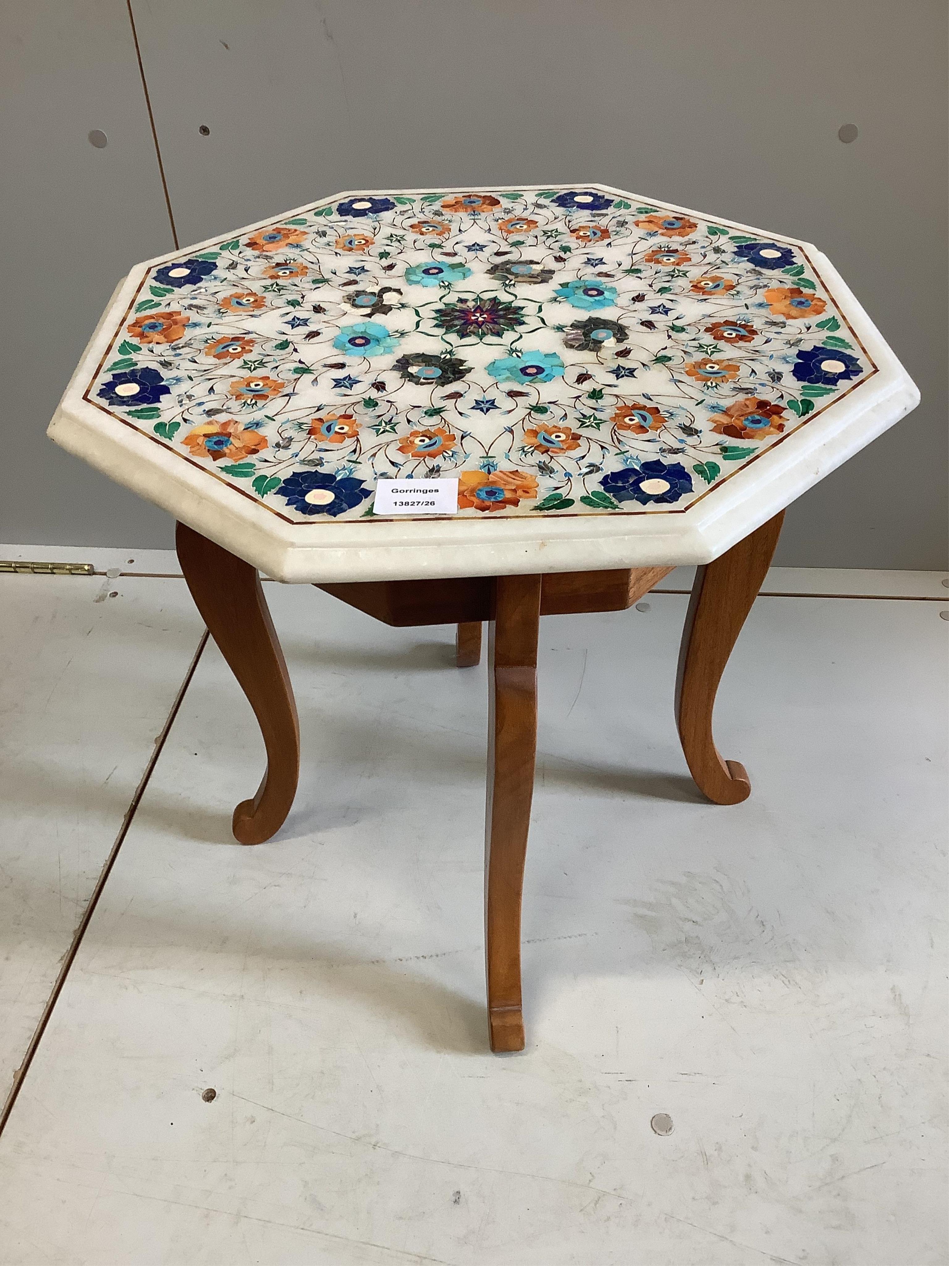 An Indian hardstone inlaid octagonal low table, width 48cm, height 46cm. Condition - good
